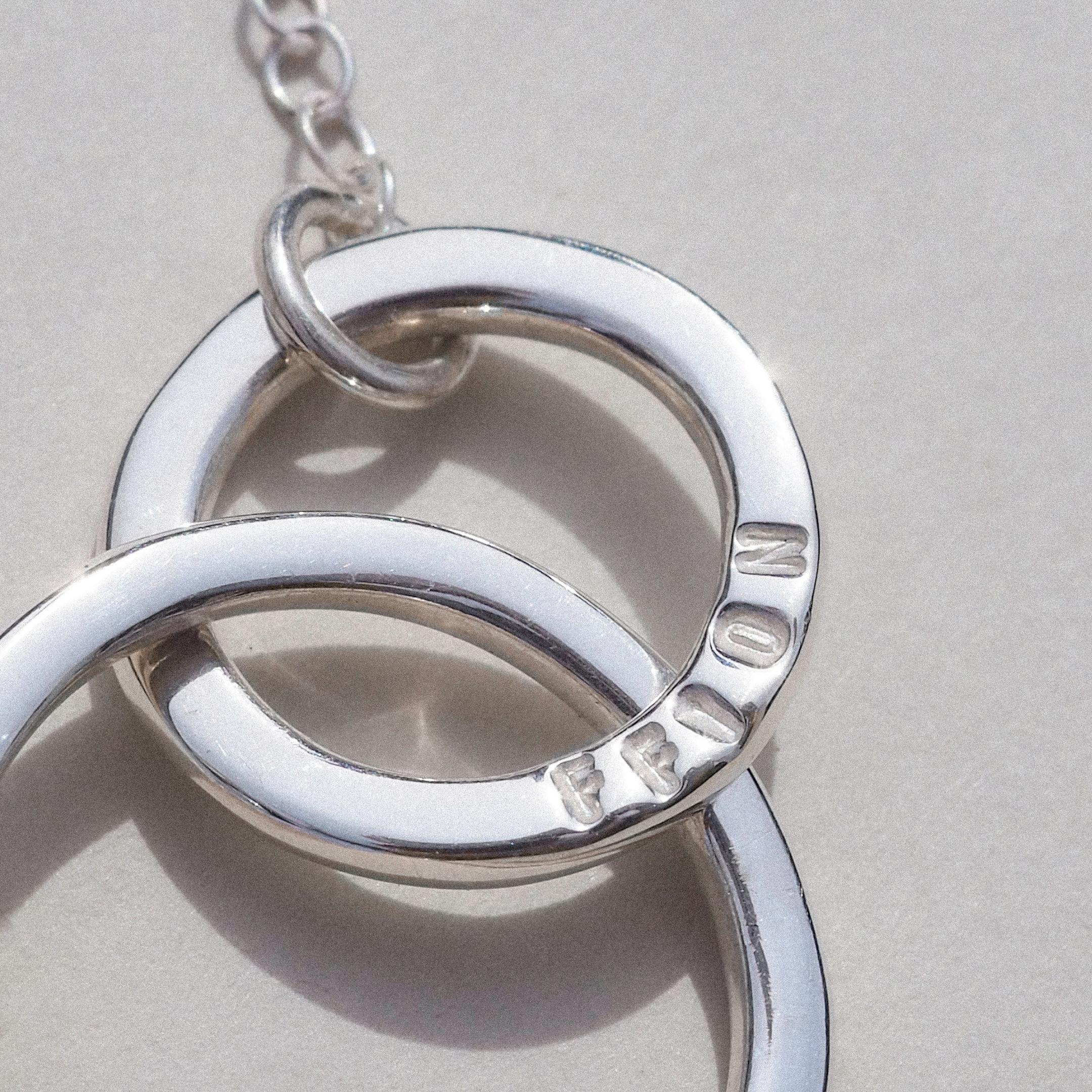 Hand-stamped mother and child necklace with one larger and one smaller ring