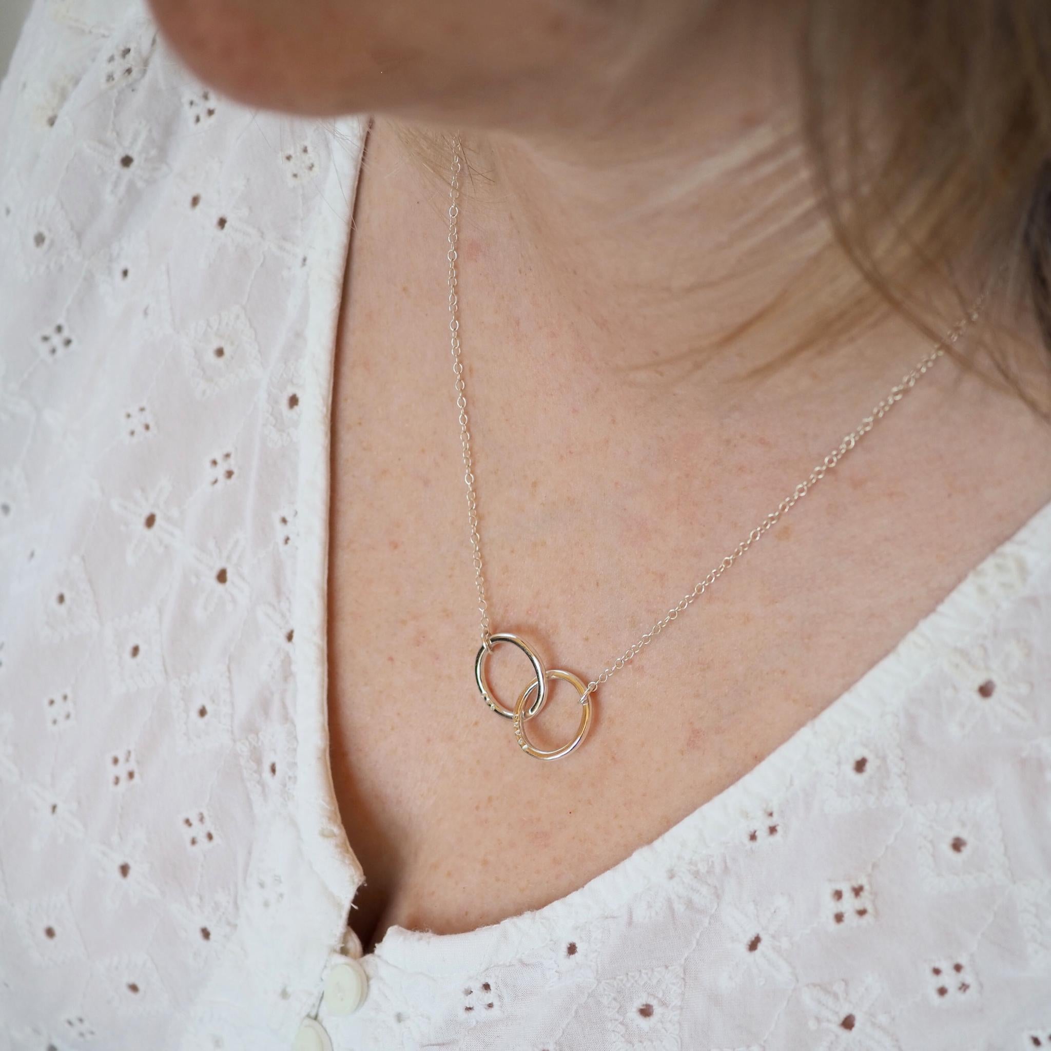 Model wearing a double halo necklace in sterling silver