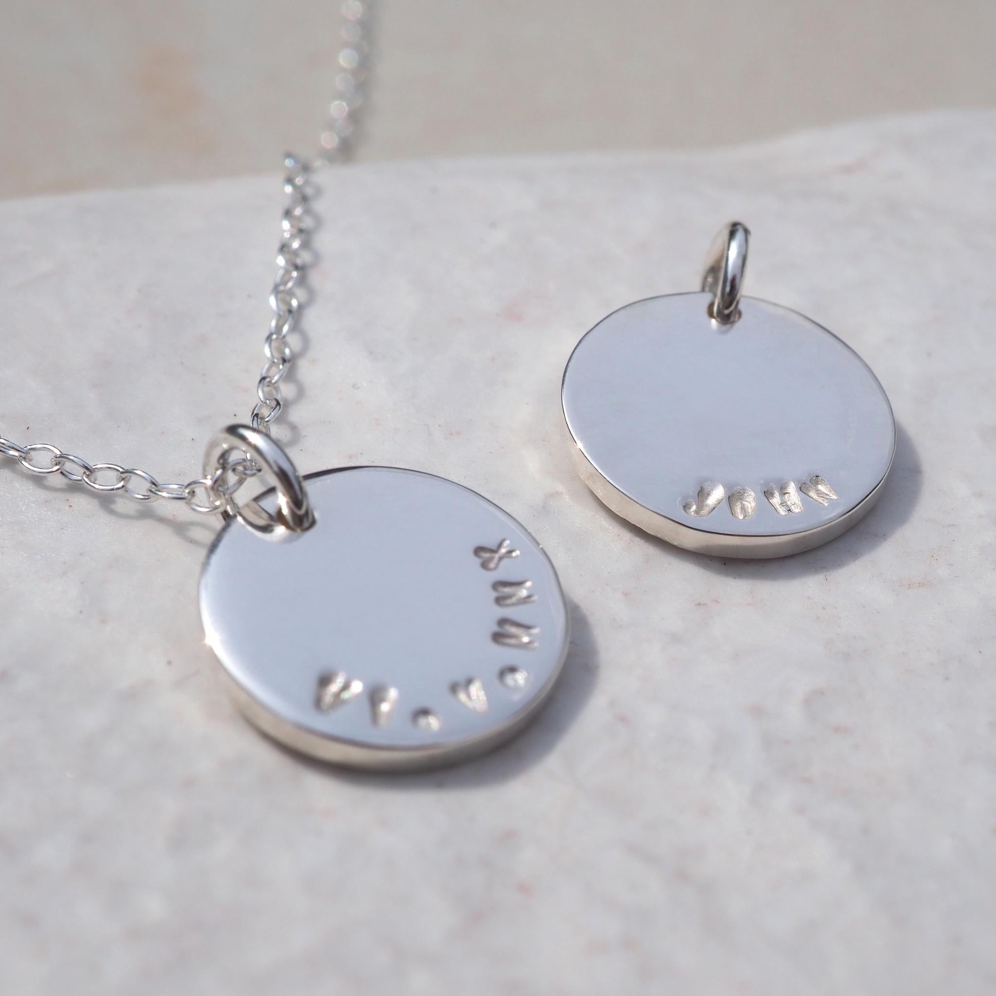 Double-sided disc necklace in sterling silver, personalised with names and dates