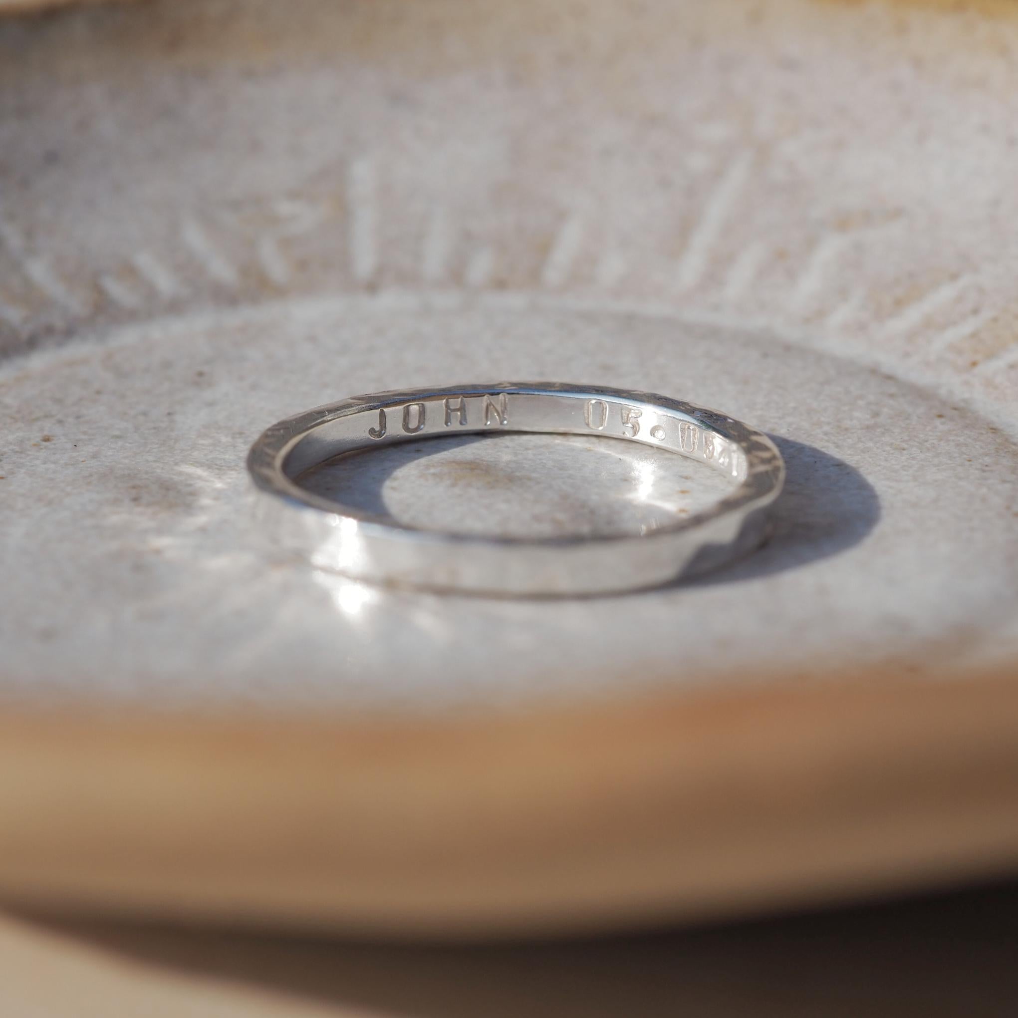 sterling silver ring personalised with a name and date on the inside.