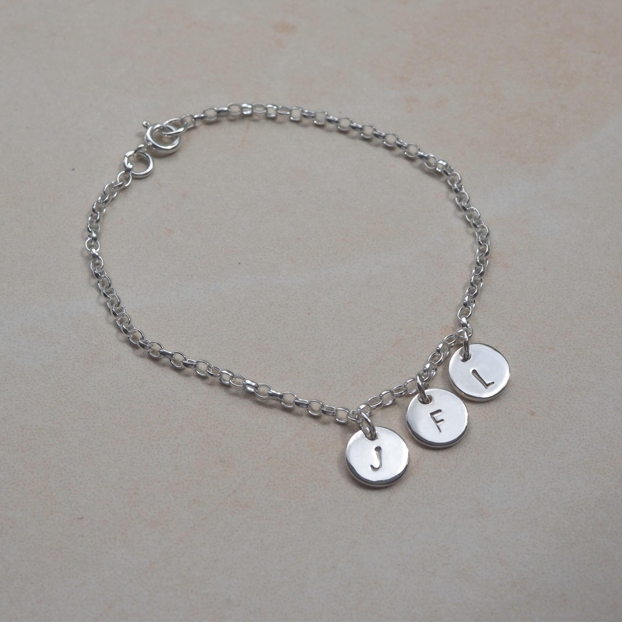 Silver bracelet with personalised hand-stamped initial charms