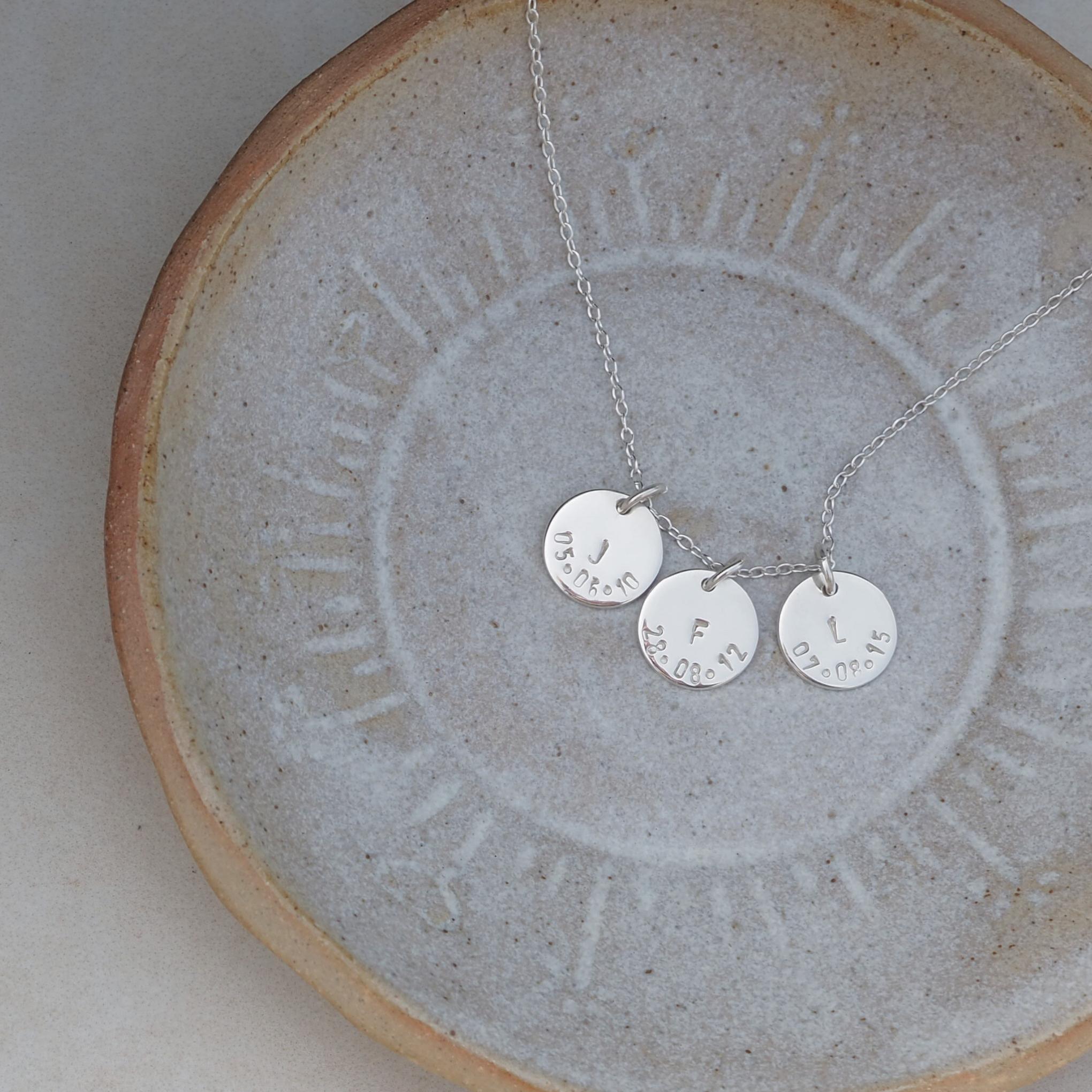 Personalised keepsake for mothers and grandmothers: triple initial and date disc necklace