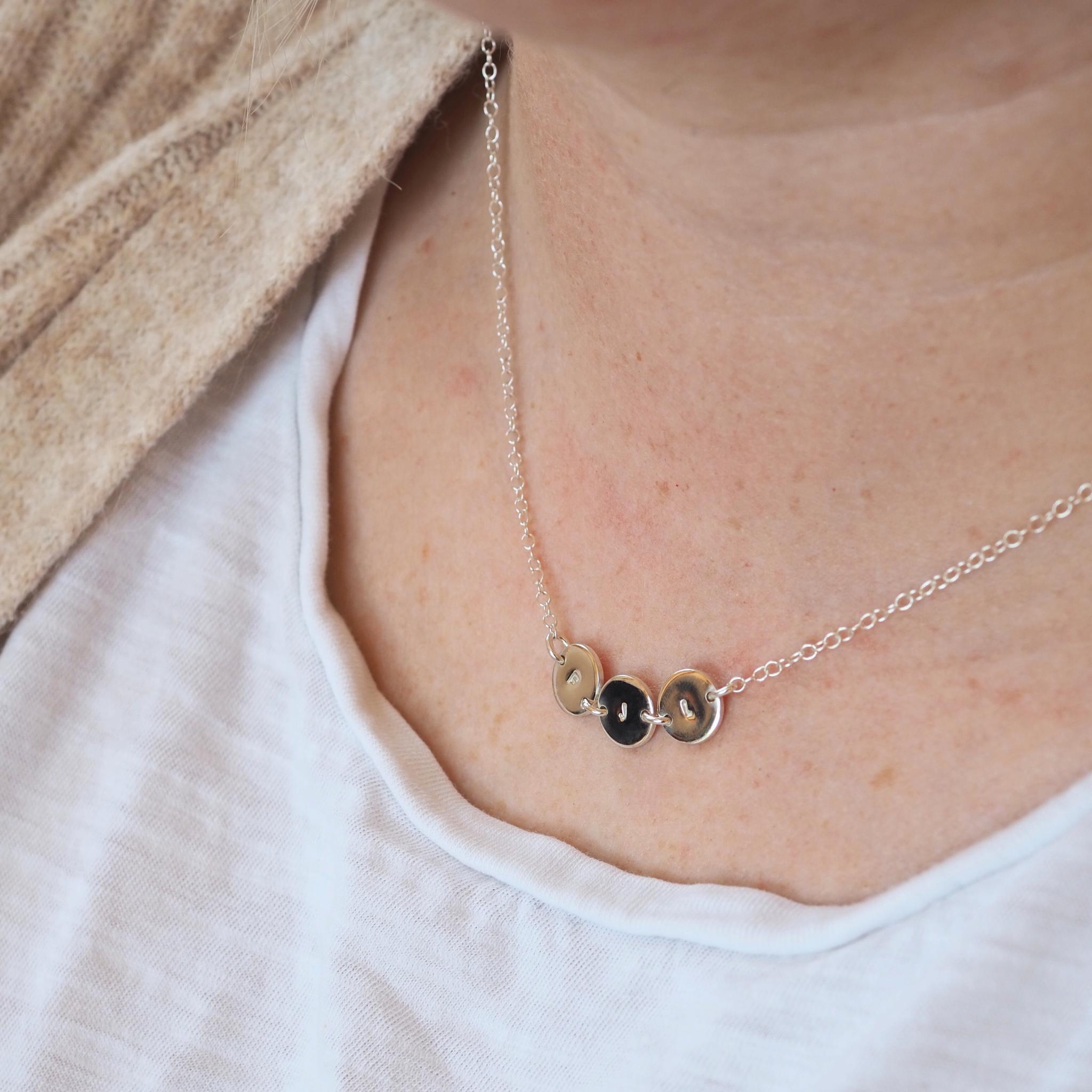 Personalised joined initial necklace with hand-stamped discs