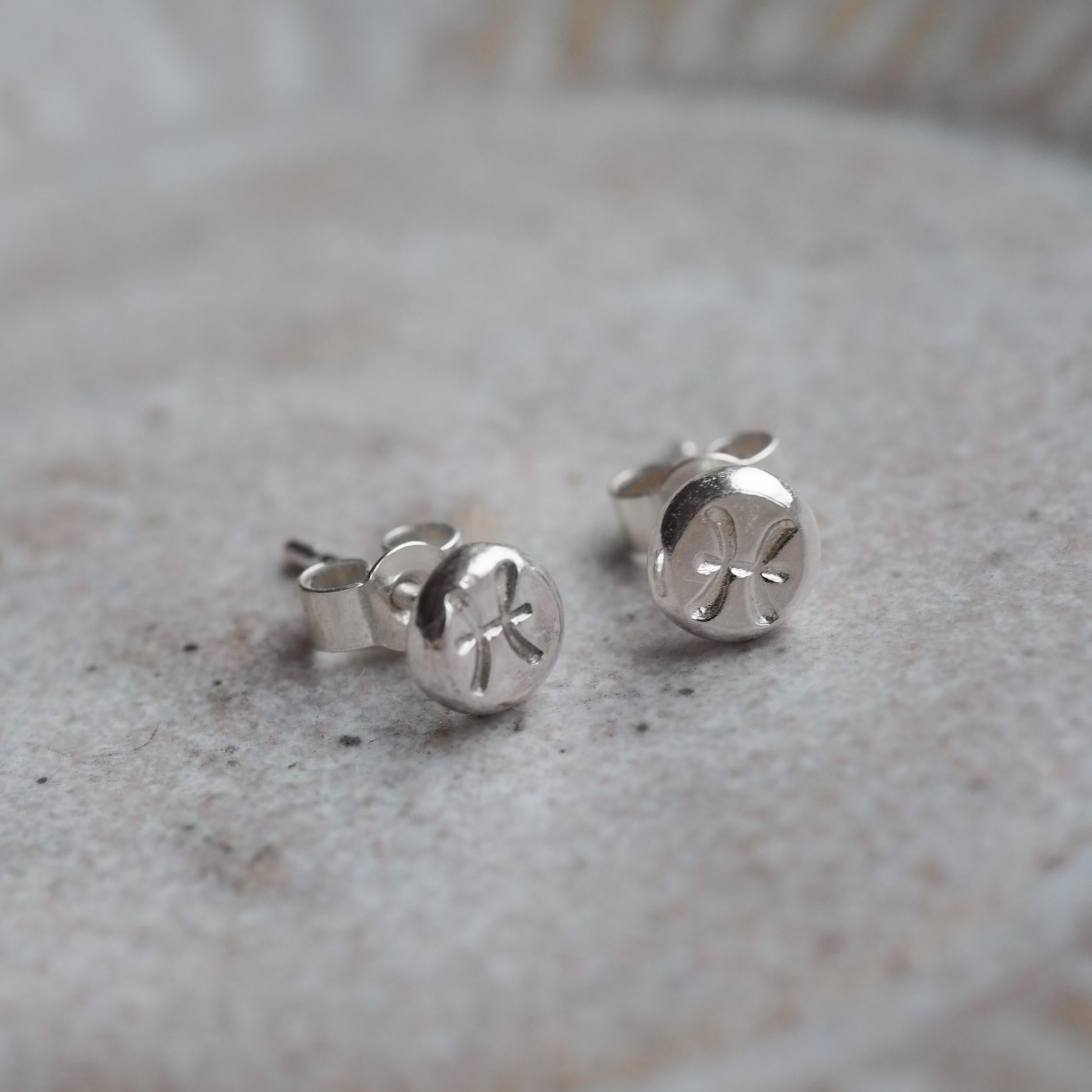 Pair of Organic Zodiac Stud Earrings with hand-stamped symbols and an organic, textured finish