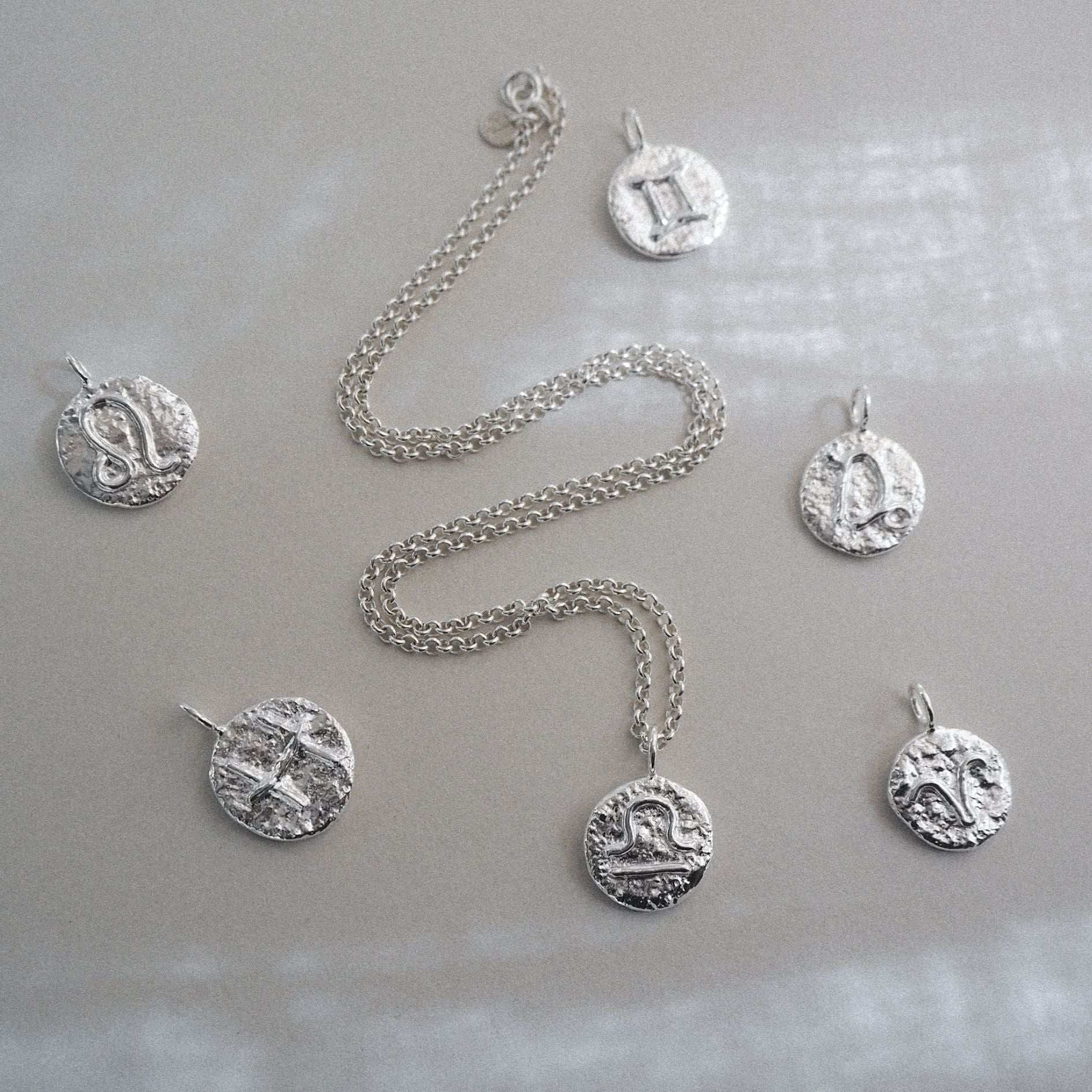 Molten zodiac necklace in sterling silver, personalised with your zodiac sign