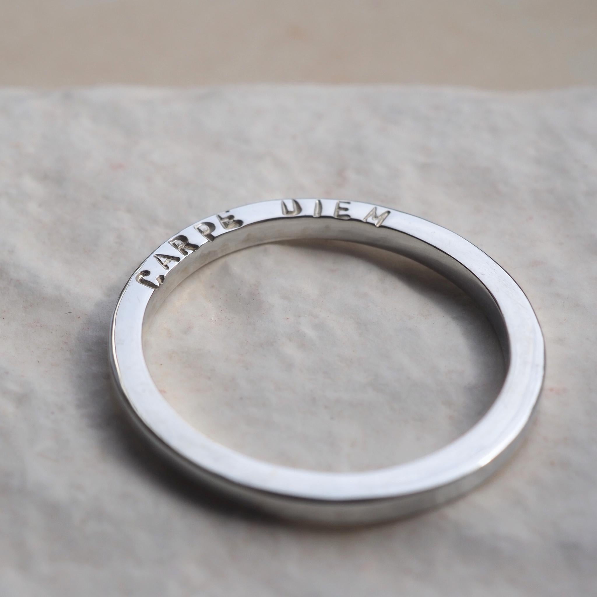 Sterling silver ring personalised on the side with the words "carpe Diem"