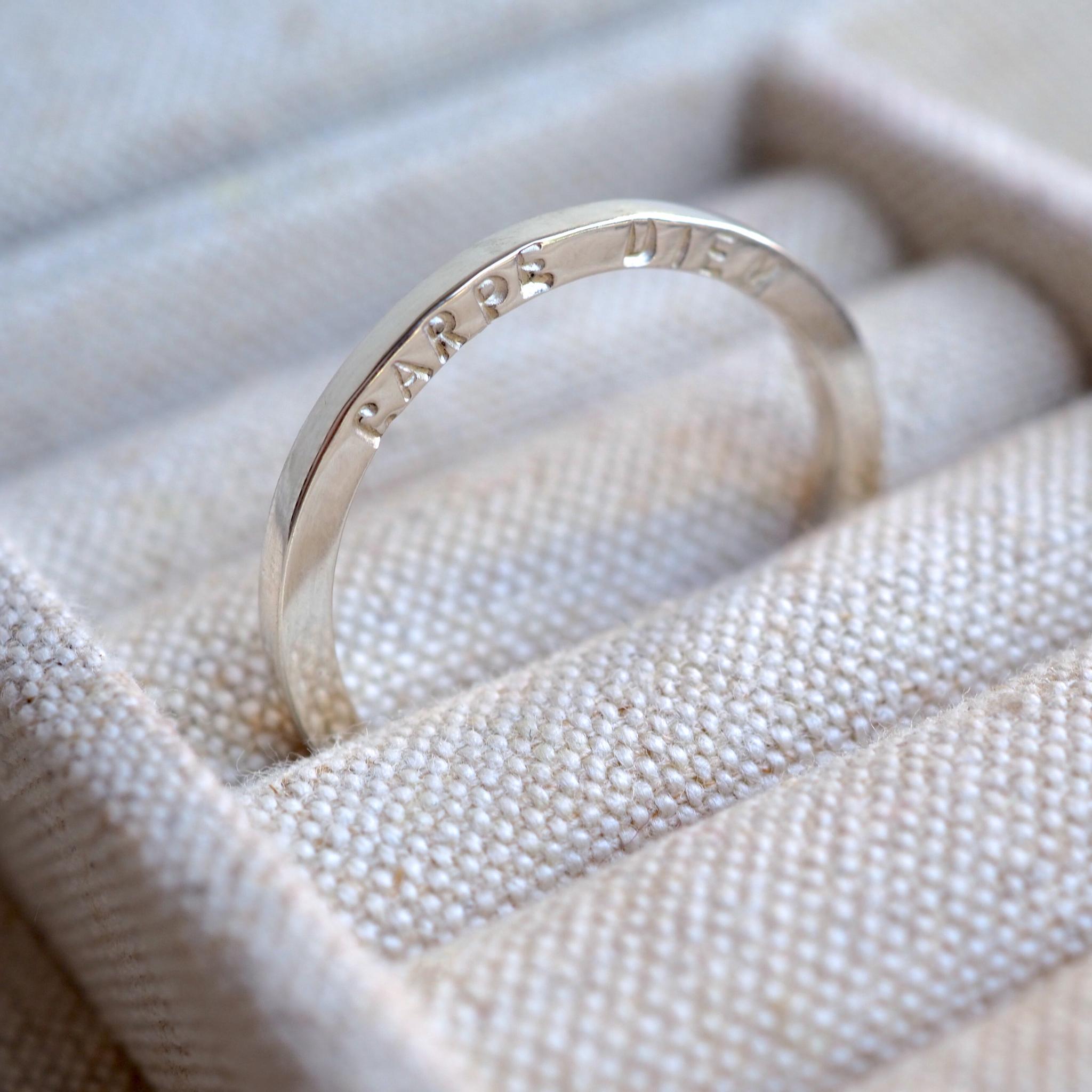 sterling silver ring personalised with hand stamped letters.