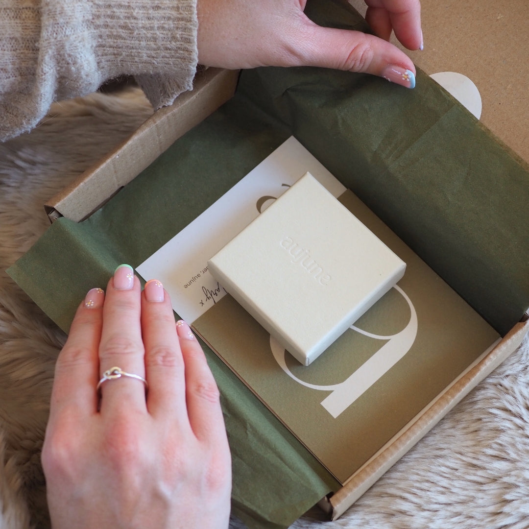 An eco-friendly aujune gift box with care card