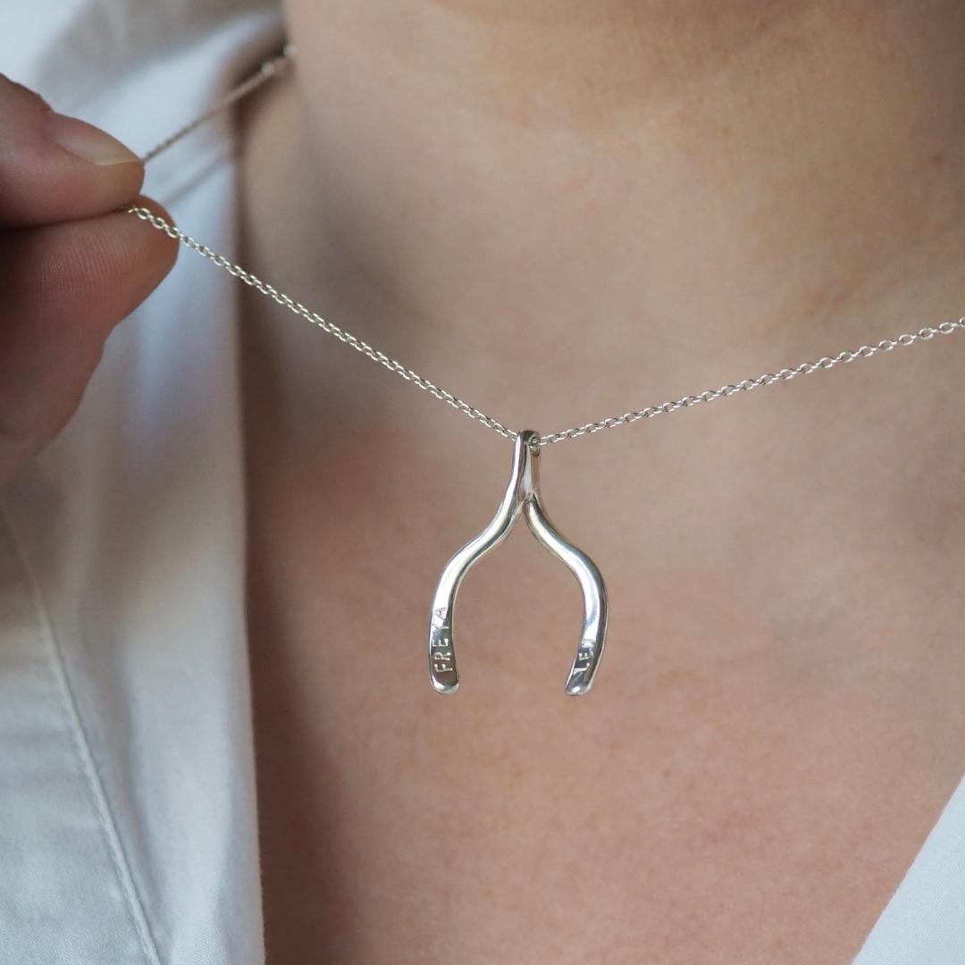 Custom wishbone necklace, silver, symbolising good luck and personalised with initials, names or dates