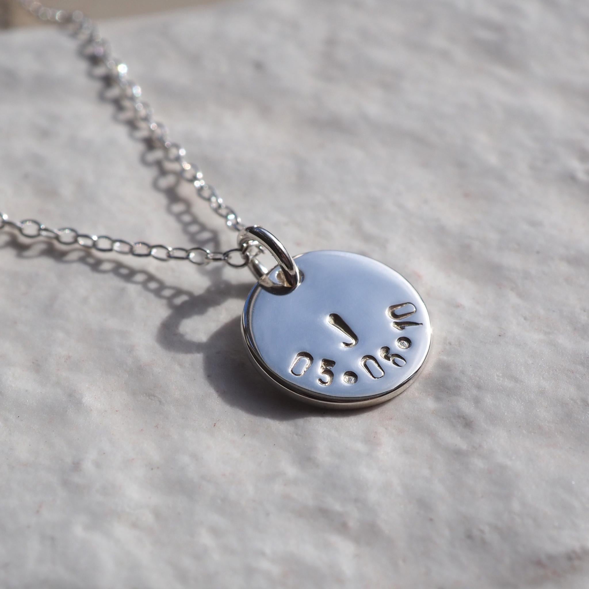 Hand-stamped initial and date  disc necklace on a trace chain