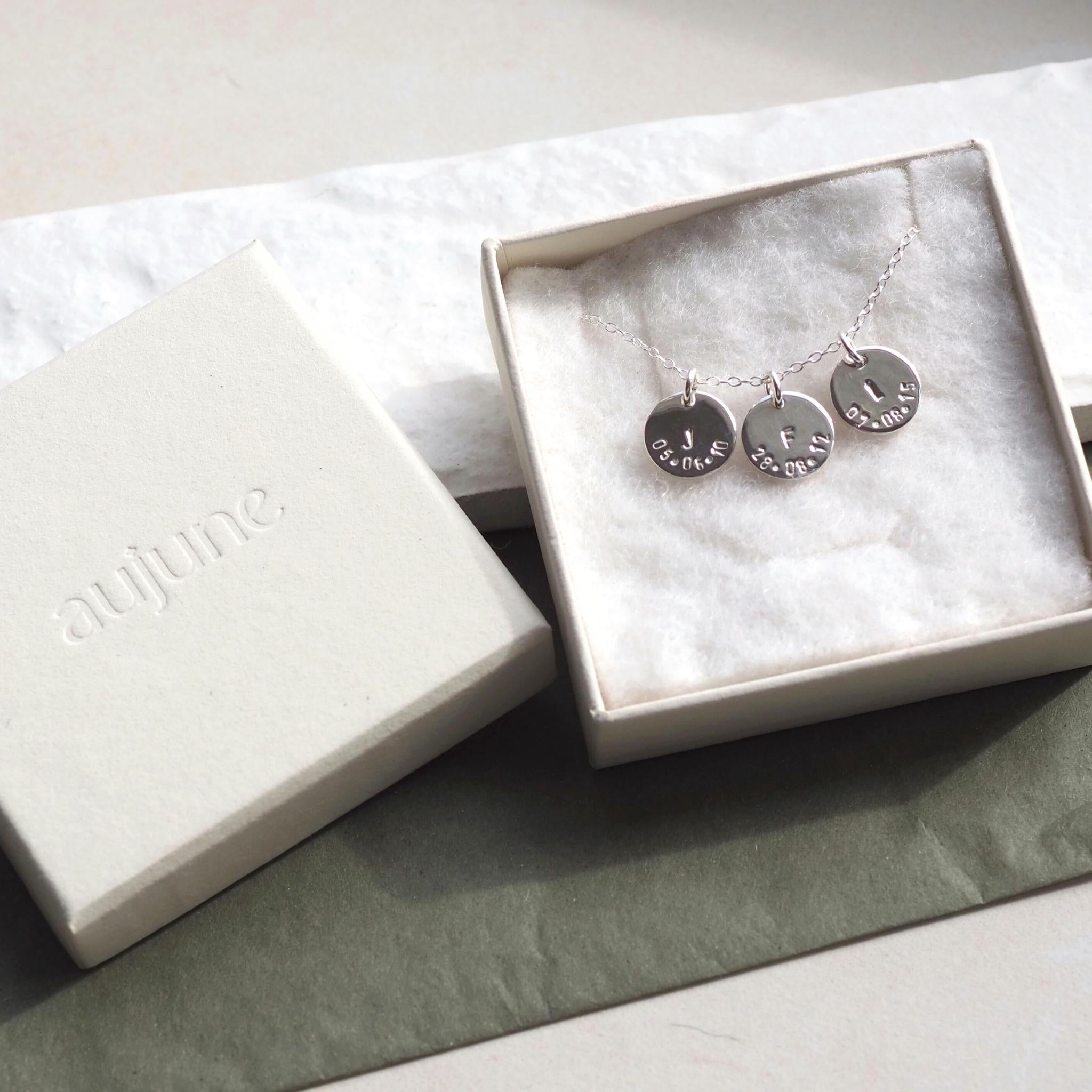 Triple initial and date disc necklace in an aujune box